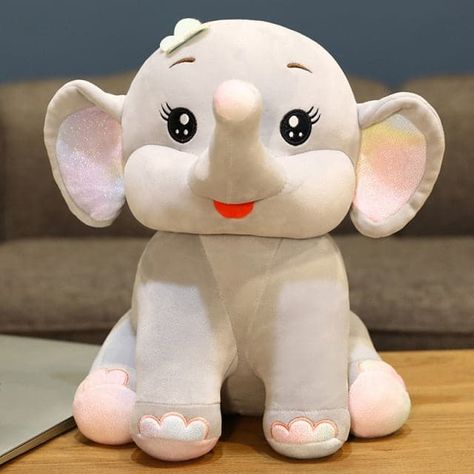 Description: 【CUTE AND SOFT】- This Elephant Plush is very soft and cuddly. Great sleeping companion. This high-quality of materials, such as super-soft polyester fibers and plush, guarantees extra durability. This little elephant friend is the softest sleeping friend you 'll ever meet. 【PERFECT GIFT】-This Plush elephant can also be used as a decorative piece in a child's nursery. Perfect toy for newborn, infant, toddlers, girl, boys and great for kid's bedroom decor, animal-themed birthday parties or as birthday, Valentine's, Christmas gifts for kids. 【SUITABLE FOR】You can give this baby elephant plush as a present such as birthday gifts, baby showers, holidays, birthday announcements, Valentine's Day, Thanksgiving, Christmas, and other special occasions. This elephant plush toy is easy to Elephant Soft Toy, Elephant Plush Toy, Large Stuffed Animals, Elephant Pillow, Hug Pillow, Big Ears, Newborn Toys, Lilo E Stitch, Elephant Plush