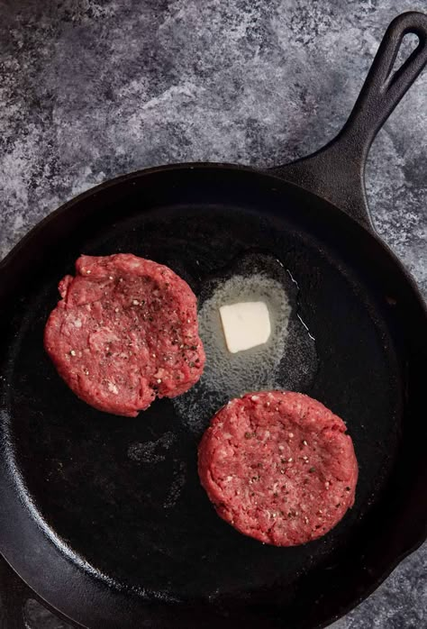 Stovetop Burgers are the perfect way to still enjoy a juicy burger even when it's too cold for grilling! Made with cheddar, onion, lettuce, and tomato. Perfect for an easy lunch or dinner or even an "indoor BBQ"! Cast Iron Skillet Hamburger Recipes, Cast Iron Burger, Hamburger Cast Iron Skillet, Best Way To Cook Burgers Indoors, Cast Iron Skillet Hamburgers, Burger In Cast Iron Skillet, Skillet Hamburger Patties, Cast Iron Burgers Recipes, Cast Iron Hamburger Recipes