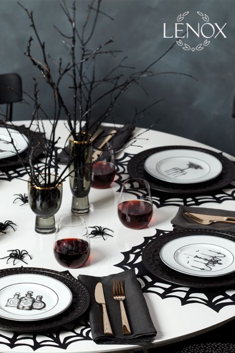 Pair the Lenox Chelse Muse Fleur Matte Black 4-piece Dinner Plate Set crafted of durable and intriguing black ironstone with wickedly enchanting Vintage Halloween 4-piece dessert plate set crafted of ivory porcelain and features hand-drawn artwork of a chandelier, a raven, potions and a candelabra. This table setting will bring a bit of haunted mystery to your home and add well with formal and casual dinnerware. #Halloween #cocktails #spookyseason #October #Halloweendecor Table Setting Halloween, Halloween Dinner Table Setting, Black Halloween Table Decor, Halloween Wedding Table Settings, Halloween Place Settings, Halloween Table Set Up, Gothic Table Setting, Halloween Dinner Table Decor, Halloween Table Decorations Party