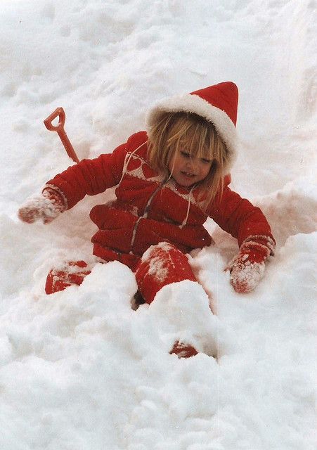 I love seeing a child, in the snow, wearing , a little red snowsuit!!!  All four pf my kids had a red snowsuit...