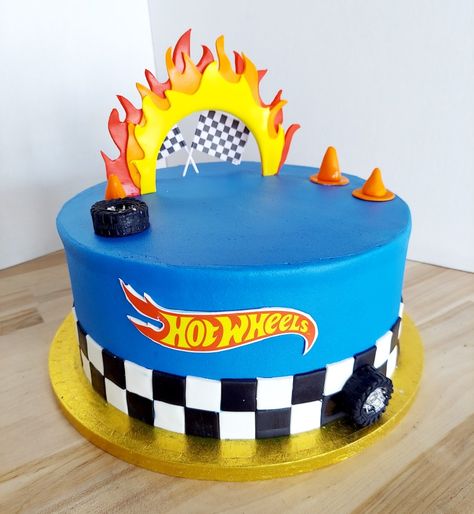 This Hot Wheels cake is perfect for your little man's birthday. Iced in buttercream with fondant design details. #americandreamcakes #customcakes #hotwheels #DecoPac Hotwheels Buttercream Cake, Hot Wheels Cake Design, Small Hot Wheels Cake, Boy Birthday Cake Design, Hot Wheels Cupcakes Ideas, Hot Wheels Cake Ideas, Hotwheels Birthday Cake, Hot Wheels Cupcakes, Wheels Cake