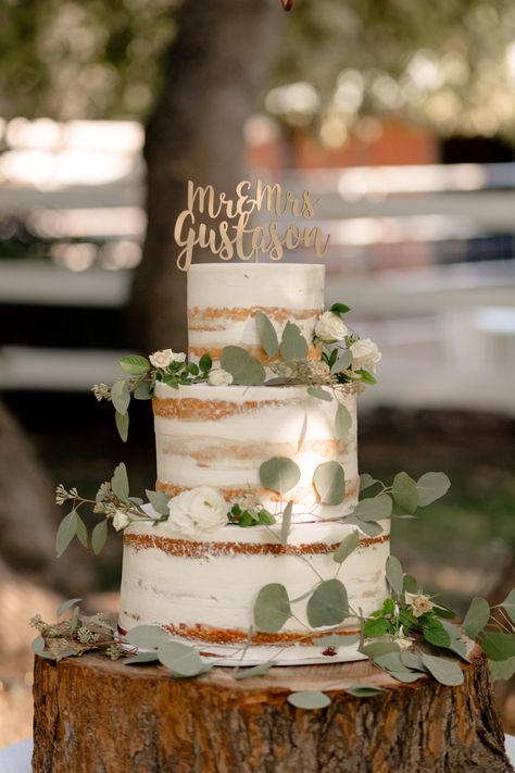 Sage and White Fairytale Wedding in the Fall #greeneryweddingcake #greeneryinspiredwedding #sagewedding #sageandwhitewedding #whiteweddingflowers #almostnakedcake #rusticfairytalewedding #rusticweddingcake #fallweddingideas Sage Green And Wood Wedding Theme, Wedding Cake Designs Elegant Sage Green, Sage Cake Wedding, Sage Green Rustic Wedding Cake, Rustic Wedding Cake Eucalyptus, Sage And Blush Rustic Wedding, Bohemian Sage Green Wedding, Boho Wedding Cake Sage Green, Rustic Wedding Sage Green