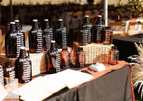 Wedding stationery•Signage on Instagram: "This was a fun one. 20+ glass jars and growlers used as a seating chart display! . @sugarwillowevents @wanderlovecaptures . #seatingchart #wedding #coloradowedding #bohowedding #boho #customseating #rockymountainbride #mountainwedding" Beer Seating Chart Wedding, Growler Seating Chart, Unique Seating Chart Wedding, Unique Seating Chart, Seating Chart Display, Unique Seating, Beer Growler, Chart Ideas, We Get Married