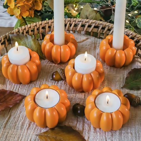 PRICES MAY VARY. Beautiful & Functional - Our new Pumpkin Shaped 2 in 1 Tealight/Candlestick Holder (Set of 6) feature vertical ribbed pumpkin outline detail and a multifunctional design. The pumpkin candle holder has an opening that can hold a standard tea light, pillar candle, or candlestick. Whether they are a gift or dining room table decorations they are sure to illuminate your night. HOME DECOR/SHELF DECOR - These rustic Pumpkin candle holders are perfect for all Autumn & Fall events or ju 6 Dining Table, Pumpkin Candlesticks, Pumpkin Outline, Pumpkin Candle Holder, Home Decor Shelves, Rustic Pumpkin, Dining Room Table Decor, Pumpkin Candles, Orange Pumpkin