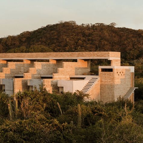 Puerto Escondido, on Mexico’s Oaxacan coast, is a well-established destination — but it’s never seen anything like Hotel Terrestre. Then again, neither has anywhere else. Set between the mountains and the sea on the verdant coast just to the west of town, it’s a dramatic structure, a spaceship made of humble, locally sourced brick and concrete by architect Alberto Kalach. No surprise that it’s Grupo Habita that’s behind this hotel; the most innovative hoteliers in Mexico continue to push the bou New Mexico Aesthetic, Arch Exterior, Puerto Escondido Oaxaca, Brick And Concrete, Boutique Hotels Design, Aesthetic Place, Crowd Funding, Oaxaca City, Other Planets