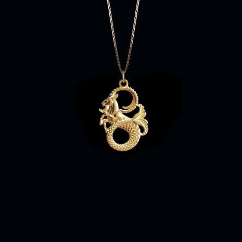 Showcase the strength and ambition of Capricorn with our gold Capricorn Pendants & Necklaces, expertly crafted in the USA. Perfect for those who identify with this zodiac sign, each piece symbolizes perseverance and practicality. 𝗣𝗘𝗡𝗗𝗔𝗡𝗧 𝗜𝗡𝗙𝗢𝗥𝗠𝗔𝗧𝗜𝗢𝗡 This pendant is made of real, solid gold. * Made in USA * Size: 𝗠𝗜𝗡𝗜 * Material: 14k or 18k solid gold * Finish: polished * Height: 0.98" (25 mm) | *includes the small circle, bail dimensions not included * Width: 0.65" (16,5 mm Capricorn Necklace, Capricorn Pendant, Capricorn Zodiac, Zodiac Necklace, Small Circle, Solid Gold Chains, Box Making, Mini Pendants, Zodiac Necklaces