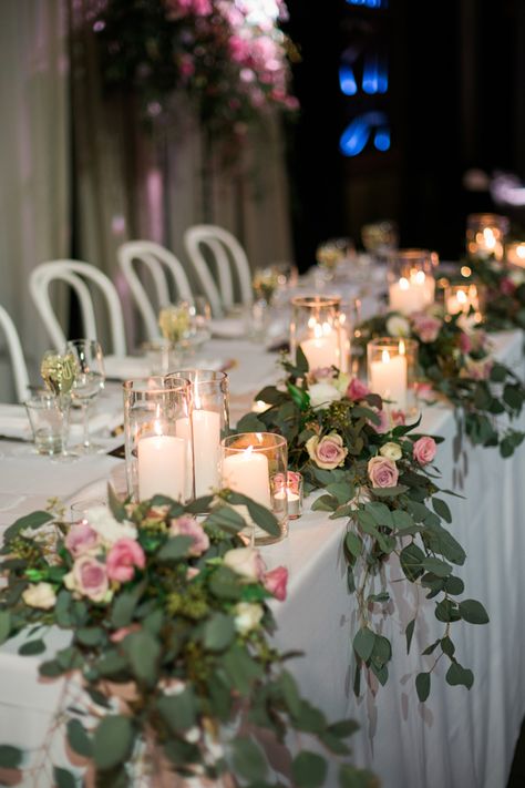 Whimsical bridal table bouquets of native gums and soft pink and mauve flowers combined with glass candle holders Bridal Table Flowers Arrangements, Bridal Party Table Decorations, Bridal Table Flowers, Table Greenery, Top Table Flowers, Head Table Wedding Decorations, Brides Table, Wedding Top Table, Bride Groom Table