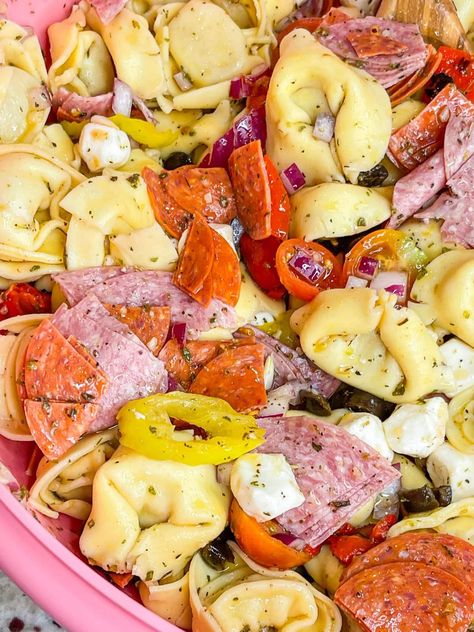 Love Italian subs? You will absolutely LOVE this Italian Sub Pasta Salad made with Italian meats, mozzarella cheese, tortellini, and veggies in a zesty Italian vinaigrette. Italian Sub Pasta Salad, Italian Potluck Ideas, Pasta Salad Tortellini, Sub Pasta Salad, Tortellini And Veggies, Italian Subs, Italian Vinaigrette, Tortellini Pasta Salad, Pasta Salad With Tortellini