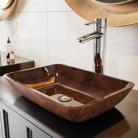 Solid tempered glass construction makes this handmade sink by Vigo® ideal for everyday use, while its unique angled shape makes it a modern update to your home. The polished interior and textured exterior are stain-resistant and easy to clean. The rich russet hues of the sink create a pretty sheen with an earthy and inviting effect – the perfect centerpiece for your bathroom.Above-counter installation for a modern lookSolid tempered glass construction with textured exterior and polished interior Vessel Sink Bathroom Vanity, Rectangular Sink Bathroom, Bath Redo, Zen Bathroom, Modern Bathroom Sink, Drain Opener, Glass Vessel Sinks, Bath Renovation, Undermount Bathroom Sink