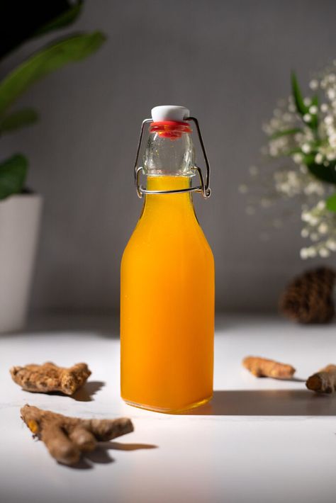 Turmeric Ginger Simple Syrup - Kitchen Habit Mango Simple Syrup Recipe, Turmeric Mocktail, Elixer Recipes, Tumeric Coffee, Ginger Syrup Recipe, 2024 Cocktails, Natural Syrup, Moody Mixologist, Ginger Mocktail