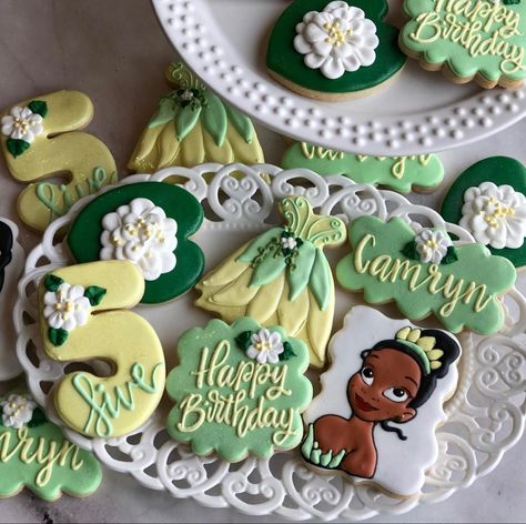 Princess and the frog cookies Princess And Frog Party Decorations, Princess And Frog Cookies, Princess Tiana Cookies Decorated, Princess In The Frog Party, Tiana Cookies Decorated, Tianas Birthday Party Ideas, Princess And The Frog Quinceanera Theme Cake, Princess Tiana 2nd Birthday Party, Princess Tiana Sweet 16 Cake