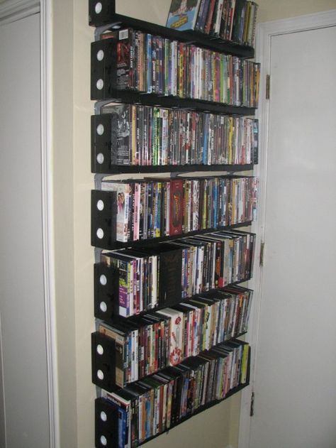 DVD shelves made from VHS tapes - LOL.  could make a good book shelf Movie Collection Shelf, Bluray Storage, Vhs Ideas, Vhs Crafts, Ikea Dvd Storage, Vhs Storage, Dvd Storage Tower, Dvd Storage Cabinet, Dvd Storage Ideas