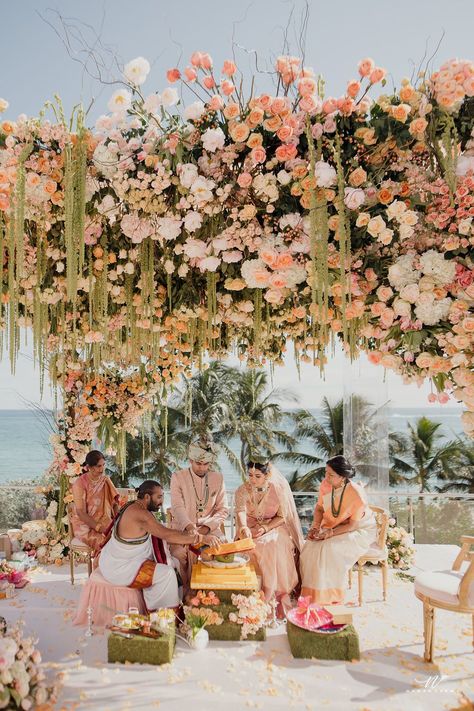 Discover 33 wedding mandap ideas from real ceremonies in settings as diverse as formal ballrooms and ocean-and-mountainside perches. Beach Mandap Decor, Whimsical Chuppah, Pastel Mandap, Wedding Mandap Ideas, Beach Mandap, Indian Beach Wedding, Mandap Ideas, Hindu Wedding Decorations, Indian Wedding Theme