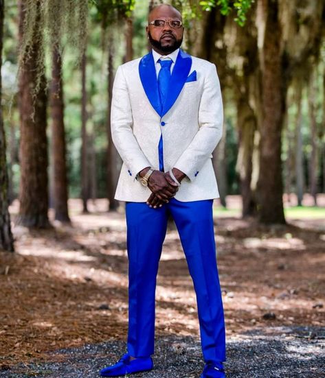 We had the pleasure of clothing another awesome groom for the big day! He rocked down the aisle in a beautifully crafted ivory and royal blue jacquard tuxedo jacket. Contact us to get fitted for your wedding day or any other special occasion and #KeepTheStyleFlowing! Royal Blue And White Tuxedo Wedding, Royal Blue Wedding Tux Groom, White And Blue Tuxedo Wedding, White And Blue Groom Suit, Royal Blue And White Tuxedo, White And Royal Blue Tuxedo, Royal Blue Tuxedo Wedding, White And Blue Tuxedo, Royal Blue Wedding Ideas