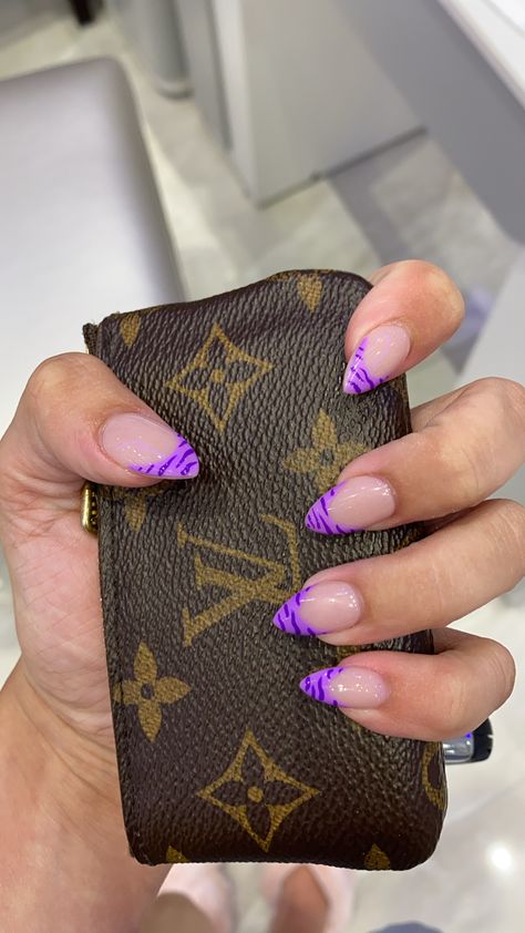 Purple french-tiped nails in the almond shape, tiger stripe pattern Purple French Almond Nails, Bright Purple French Tip Nails, Clemson Tiger Nails, Patterned French Tip Nails, Pattern French Tip Nails, Purple Zebra Nails, Tiger French Nails, Clawdeen Nails, Purple Nails French Tip