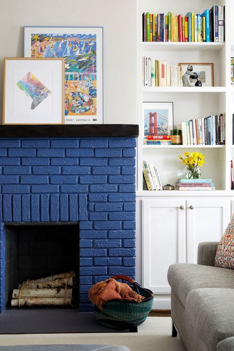 Blue Painted Brick Fireplace With White Cabinet And Shelfs Black Brick Fireplace, White Brick Fireplace, Painted Brick Fireplace, Painted Brick Fireplaces, Andong, Brick Fireplace Makeover, Paint Fireplace, Gyeongju, Brick Backsplash