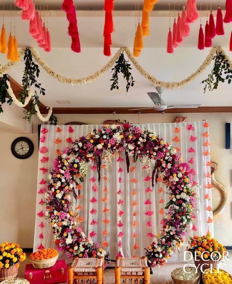 Traditional Indian Decor with tassels and flowers. Ring Backdrop with tassel strings on the ceiling. Contact us for further details.

#tassels#flowers#ring#backdrop#mehendidecor#traditionaldecor#weddingdecor#indianweddingdecor#thedecorcycle Ring Backdrop Ideas, Ganpati Ring Decoration, Indian Gender Reveal Ideas, Flower Ring Backdrop, Ring Backdrop Decoration Ideas, Ring Ceremony Decoration Indian, Rice Ceremony Decoration Indian, Traditional Baby Shower Indian, Indian Wedding Backdrop Decorations