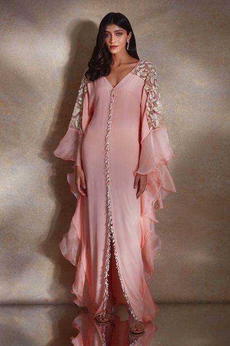 Peach kaftan featuring bead and pearl tassels along the bodice, floral sequin embroidered sheer shoulder panels and ruffle tiered sleeves. - Aza Fashions Peach Crepes, Pearl Tassels, Kaftan Designs, Winter Sun, Simple Pakistani Dresses, Abaya Designs, Arab Fashion, Coral Dress, Stylish Dress Book