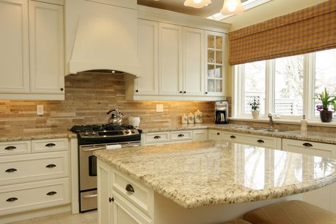 Giallo Ornamental Granite for Warm & Elegant Kitchen Design | Aqua Kitchen & Bath Design Center Kitchen Cabinets And Backsplash, Beige Kitchen Cabinets, Backsplash Kitchen White Cabinets, Beige Backsplash, Granite Island, Elegant Kitchen Design, Outdoor Kitchen Countertops, Cabinets White, Paint Kitchen