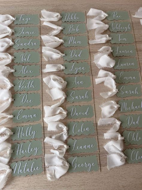 10cm x 5cm rectangle shapes, customised with each wedding guests' name to add to your tables. As standard, these items are sold with clear acrylic with vinyl in a colour / font of your choice - DM us with your specific requests +50p for painted items +50p for hole and frayed ribbon (white, cream, beige, pink, sage - other colours may be available upon request)  10% discount when ordering 50+ 15% discount when ordering 100+ items (DM us before ordering) Delivery will be dependent on the amount ch Clear Name Card, Acrylic Place Names Wedding, Wedding Table Setting With Name Card, White And Sage Wedding Table Setting, Acrylic Table Names, Wedding Name Settings, Sage Place Setting, Placement Cards Wedding Ideas, Name Cards For Wedding Place Settings