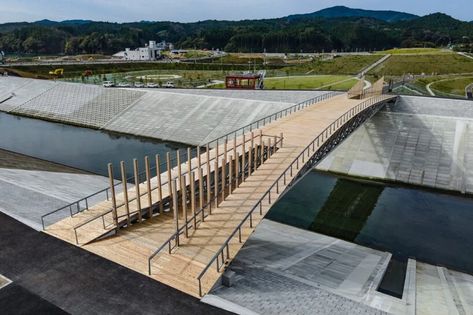 kengo kuma shapes gently arched bridge for minamisanriku, japan Bridges Architecture, Arched Bridge, Bridge Structure, Viewing Platform, Wooden Columns, Steel Trusses, Pedestrian Walkway, Torii Gate, Kengo Kuma