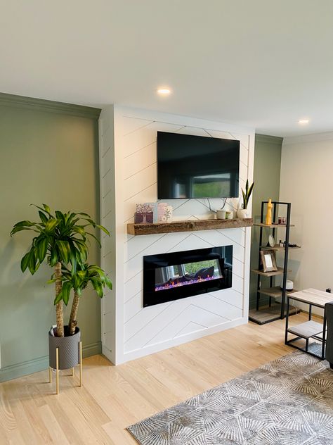 Our Shiplap fireplace with evergreen fog walls White Fireplace Green Wall, Green Wall White Fireplace, Evergreen Fog Fireplace, Herringbone Shiplap Fireplace, Evergreen Fog Walls, Green Fireplace Wall, Vertical Shiplap Fireplace, Vapor Fireplace, Herringbone Fireplace