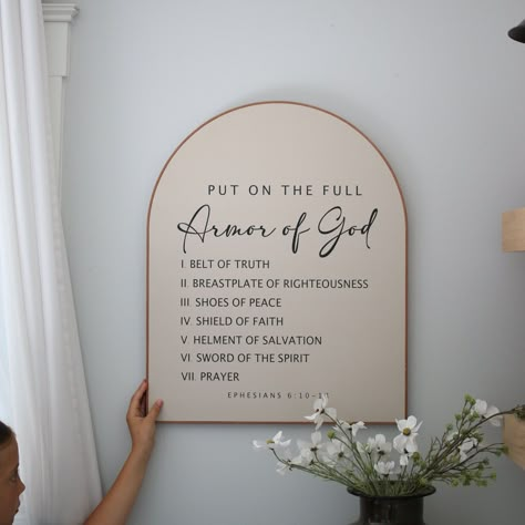 ~~ We do custom verses, please message us what scripture you would like, and we will send you a link to purchase through :) ~~ **Sign comes with verse (Ephesians 6:10) ** You choose the sign color (Black, white, smokey beige) as well as the leather frame color (Black, Cognac (tan * Choose from 4 different sizes in the drop down menu: (16x20) (20x24) (24x30) (30x36) * Handmade wood sign * Constructed from treated 3/4" plywood * Sign is pictured in **Smokey beige/Black lettering/Tan leather frame** **Every sign we create is handmade from start to finish, so there will be variations in texture, technique and overall appearance. We use 3/4" maple plywood, so some pieces may include slight lines, cracks, indentations. All the leather we use is purchased from a harness shop that cuts genuine cow Christian Dining Room Decor, Shoes Off Sign Entryway, Arched Sign, Decorate Hallway, Wood Sign Sayings, Arch Wall Art, Plywood Sign, Wall Art Modern Farmhouse, Arch Art