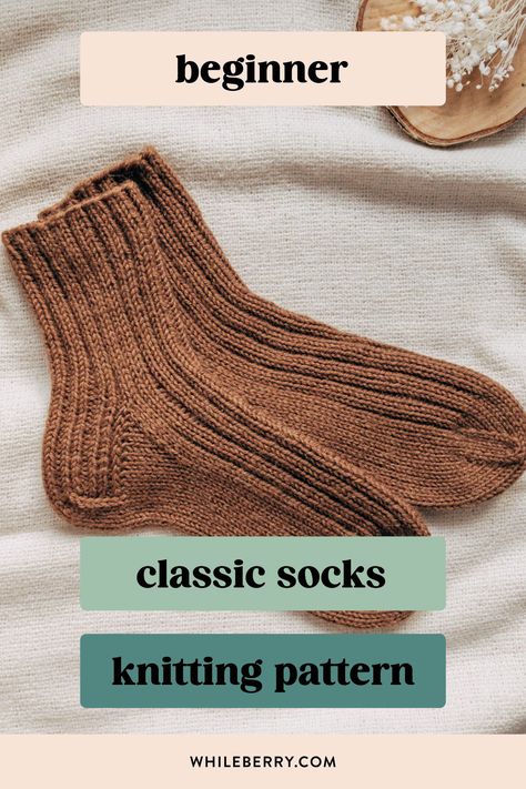 If you've always wanted to knit basic cozy socks, use this minimalist knitting pattern to knit your first simple sock pair! Using worsted weight yarn, they are super quick to knit and will be a great choice for gift knitting too. Find this beginner sock knitting pattern at whileberry.com Handknit Socks Free Pattern, Ribbed Socks Knitting Pattern, Beginner Knit Socks Free Pattern, What To Knit For Beginners, Quick Knitted Gifts, Small Knitting Projects For Beginners, Free Sock Pattern, How To Knit Socks For Beginners, Worsted Weight Sock Pattern Free