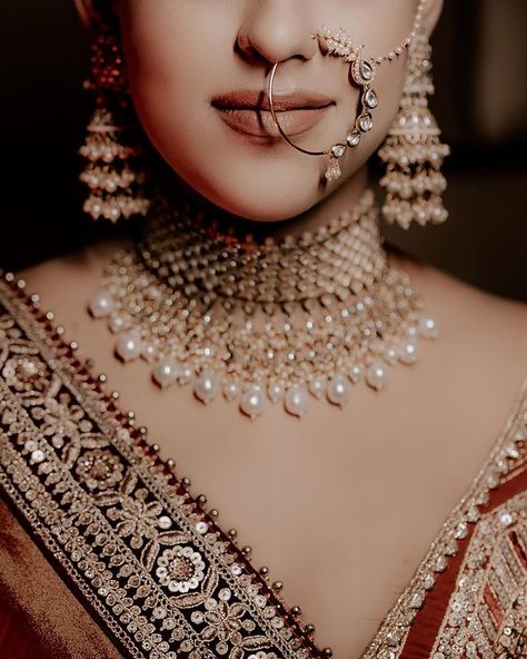 Latest Bridal Nath Designs For Indian Brides Bridal Nath Designs, Nath Designs, Nath Bridal, Bridal Nath, Indian Brides Jewelry, Nose Jewels, Bridal Ornaments, Nath Nose Ring, Gorgeous Wedding Hairstyles