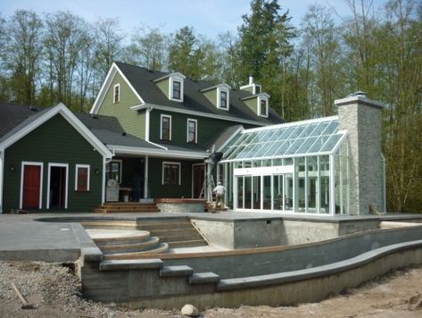 LOVE the attached greenhouse, especially with the chimney at the end, i want one directly off my kitchen <3 Greenhouse Attached To House, Contemporary Greenhouses, Attached Greenhouse, Greenhouse Farming, Conservatory Greenhouse, Best Greenhouse, Polycarbonate Greenhouse, Build A Greenhouse, Home Greenhouse