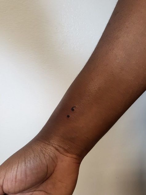 Small Tattoos For Black Women Skin, Wrist Tattoos For Women Small Semi Colon, Semi-colon Tattoo Dainty, Semi-colon Tattoo Minimalist, Semi-colon Tattoo Black Women, Small Tattoo Black Women, Small Tattoos On Black Women, Semi-colon Tattoo Ideas Wrist, Subtle Semi-colon Tattoo Ideas