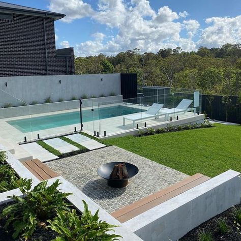 Outdoor Designer Store on Instagram: "Weekend Reset ✨...​​​​​​​​ ​​​​​​​​ Lazing by the pool in this backyard retreat is set to balance and nourish your mind, body & soul.​​​​​​​​ ​​​​​​​​ Designated fire pit area is fantastic feature in creating a focal point and a place for people to gather around and connect. ​​​​​​​​ .​​​​​​​​ Landscaping by @fcglandscaping" Backyard Pool Fire Pit, Plunge Pool And Fire Pit, Fire Pit Pool Area, Fire Pit Near Pool Area, Pool Outdoor Area, Small Pool Landscaping Ideas, Backyard Pool And Fire Pit Ideas, Pool And Fire Pit Ideas Backyards, Fire Pit Next To Pool