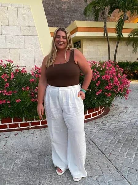 Plus size beach resort outfit 🏖 the white linen pants from eloquii run true to size, or size down if in between sizes. You can save 50% off on the wide leg linen pants right now, too! The brown bodysuit from old navy also runs true to size and I would size down if in between sizes. I paired the outfit with my birks for the sake of packing light, but the outfit would look great with a heel or nicer sandal too! #LTKsalealert #LTKcurves #LTKunder100 Linen Pants Outfit Plus Size, Brown Linen Pants Outfit, Plus Size Linen Pants Outfit, Wide Leg Linen Pants Outfit, Vacation Plus Size, White Linen Pants Outfit, Wide Linen Pants, Brown Linen Pants, Linen Beach Pants