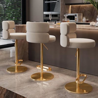 Introducing our contemporary bar stool that combines sleek style with versatile functionality. Crafted with a durable stainless steel frame and a comfortable suede-like cushion, this stool promises both elegance and ergonomic support. Its 360-degree swivel and height adjustment features make it a perfect addition to any modern space, offering a seamless blend of comfort, convenience, and safety. Everly Quinn | Everly Quinn Jammie Swivel Adjustable Height Stool brown / gray / yellowUpholstered / Modern Kitchen Island Stools, Barstools In Kitchen, Modern Bar Stools Kitchen, Bar Chairs Design, Contemporary Bar Stool, Commercial Bar Stools, Luxury Bar Stools, Island Stools, Chairs Design