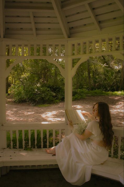 white dress, white gazebo, dreamy photoshoot, fairy, fairy vibes, fairy photoshoot, 70s style white dress, auburn hair, romeo and juliet, academia, reading, book photoshoot, photography ideas. Cottagecore Dress Photoshoot, Cottagecore Indoor Photoshoot, White Dreamy Dress, Photo Shoot Ideas Poses, Fairy River Photoshoot, Desi Senior Pictures, Fairy Debut Theme Photoshoot, Princess Style Photoshoot, Fairy Like Photoshoot