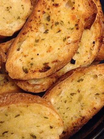 Make-Ahead Garlic Toast Recipe | Allrecipes Garlic Toast Recipe, Garlic Toast, Seasoned Butter, Scones Ingredients, Garlic Bread Recipe, Leftover Bread, Recipes Appetizers And Snacks, Italian Bread, Make Ahead Meals