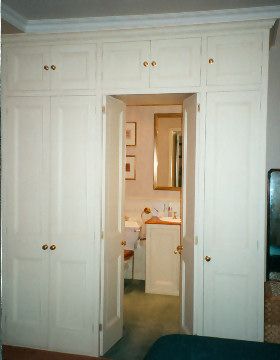 Wardrobe With Door To Bathroom, Mirror In Cupboard Door, Wardrobe To Bathroom, Hidden Vanity In Wardrobe, Hidden Dressing Room Door, Wardrobe With Hidden Bathroom Door, Walk Through Wardrobe To Ensuite, Hidden Bathroom Door, Fitted Cupboards