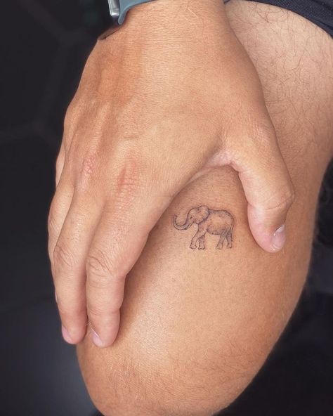 Mini Elephant Tattoo Realism Elephant Tattoo, Mini Elephant Tattoo, Tattoo On The Thigh, Little Elephant Tattoos, Thumbprint Tattoo, Realistic Elephant Tattoo, Baby Elephant Tattoo, Elephant Tattoo Ideas, Tiny Designs