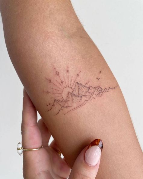 Fine line sunset and mountains tattoo on the inner Small Nature Tattoo, Moutain Tattoos, Small Mountain Tattoo, Mountain Tattoos, Tato Jari, Sunset Tattoos, Hiking Tattoo, Muster Tattoos, Elbow Tattoos