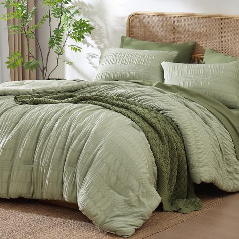 PRICES MAY VARY. Exquisite Design: This Seersucker king comforter set features a fluffy and unique puckered texture design, with stripes of varying widths presenting an elegant appearance, creating a sophisticated 3D wavy visual effect, adding a fashionable, exquisite and romantic atmosphere to your room Soft & Breathable: Crafted from 100% premium microfiber, our king bedding sets are durable, hypoallergenic, and breathable. The 240 GSM soft microfiber filling offers the perfect warmth and comf Cozy Green Bedding, Light Green Comforter Bedroom, Green Bed Ideas, King Bed Comforter Sets, Beige Green Bedroom, Neutral Master Bedrooms Decor, King Bedding Ideas, Bedding Sets Cozy, Sage Green And Pink Bedroom