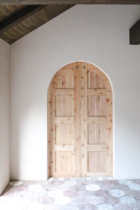 www.cavieandco.com // Handcrafted with love and care, our Barn Doors make a difference. A portion of every sale helps fund the fight against child slavery. #cavieandco Arched Pocket Door, Arched Barn Door, Spanish Transitional, Bridal Boutique Interior, Arched Doorways, Arch Doorway, Custom Barn Doors, Happy Friyay, Double Doors Interior