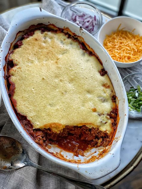 I always joke that my favorite part of chili is the cornbread, but I couldn't be more serious!  I love the combination of chili and cornbread, so to me, this recipe is a match made in heaven.  Traditional beef chili is topped with corn muffin batter to create the ultimate sweet topping to compliment the savory chili. I like to think of this as a chili and cornbread version of shepherd's pie.  This recipe is easy to make, delicious, hearty, and even though it is healthy, there is nothing "light" Chili With Cornbread Topping, Chili With Cornbread, Sweet Savory And Steph, Cornbread Topping, Tamale Pie Recipe, Healthy Chicken Pot Pie, With Cornbread, Chili Toppings, Chili And Cornbread