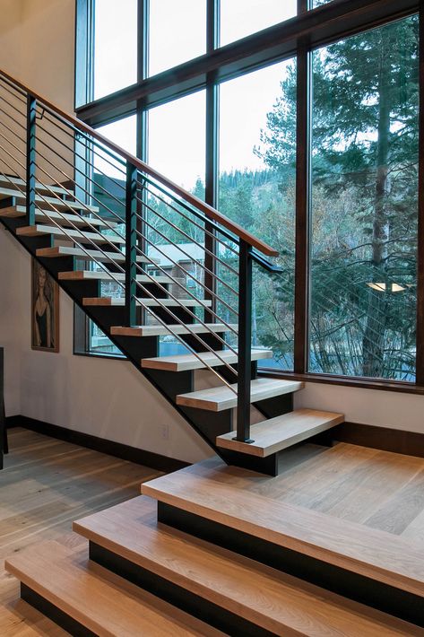 Truckee, CA | This stairwell is open to stunning forest views and warm sunlight thanks to oversized modern windows | E-Series Picture Windows Staircase Window, Modern Stair Railing, Staircase Design Modern, Stairs Design Interior, House Staircase, Eagle Nest, Escalier Design, Stair Railing Design, Open Staircase