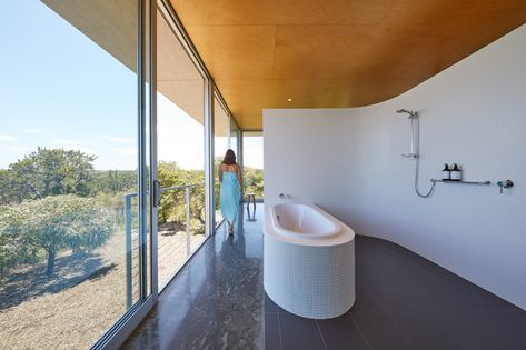 Gallery of The Bathroom Behind the Bed: 8 Bedrooms With Integrated Bathrooms - 2 Bathroom Behind Bed, Open Bathrooms, Herringbone Tile Pattern, Black Wall Tiles, Open Bathroom, Walk In Shower Designs, Passive Solar Design, Shower Designs, Solar Design