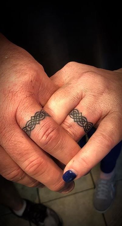 100 Unique Wedding Ring Tattoos You’ll Need to See - Tattoo Me Now Knot Ring Tattoo, Wedding Ring Tattoo Designs, Celtic Ring Tattoo, Wedding Ring Tattoo For Men, Couple Ring Finger Tattoos, Wedding Ring Finger Tattoos, Tattoo Rings, Wedding Ring Tattoos, Marriage Tattoos