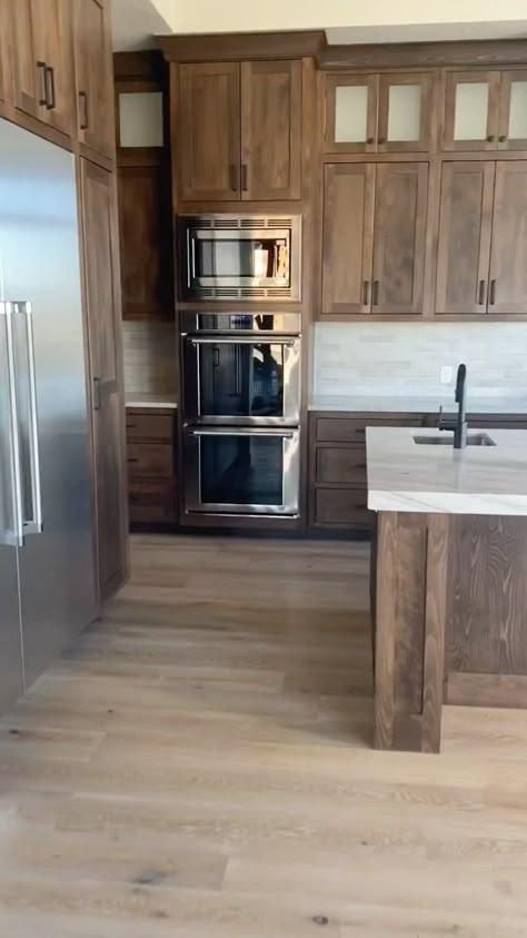 Wood Stain Kitchen Cabinets Ideas, Kitchen Light Cabinets Dark Counter, Contrast Trim In Kitchen, Wood Cabinets Stainless Steel Appliances, Kitchen With Medium Brown Cabinets, Flooring To Go With Dark Wood Cabinets, Stained Alder Kitchen Cabinets, Wood Cabinet Stain Colors, Brown Cabinets Light Floors