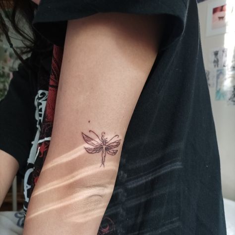 An arm in the sunlight from a window with a tattoo. Small lines, minimalistic pixie/dragonfly/fairy Small Pixie Tattoo, Fairy Finger Tattoo, Dragonfly Fairy Tattoo, Pixie Fairy Tattoo Ideas, Pixie Tattoo Fairy, Pixie Tattoos, Rave Tattoo Ideas, Rave Tattoo, Fairy Dragonfly