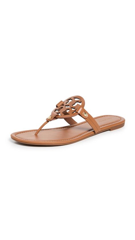 PRICES MAY VARY. Rubber sole Logo cutout Dust bag included Flip-flops Flat profile A grown-up version of your favorite flip flops. These signature Tory Burch Miller sandals showcase a cutout logo that brings a branded touch to the easy slides. Tory Burch Sandals Outfit, Xmas Wishlist, Tory Burch Flip Flops, Wishlist 2024, Tory Burch Miller Sandals, Cute Modest Outfits, Tory Burch Sandals, Sandals Outfit, Embellished Sandals