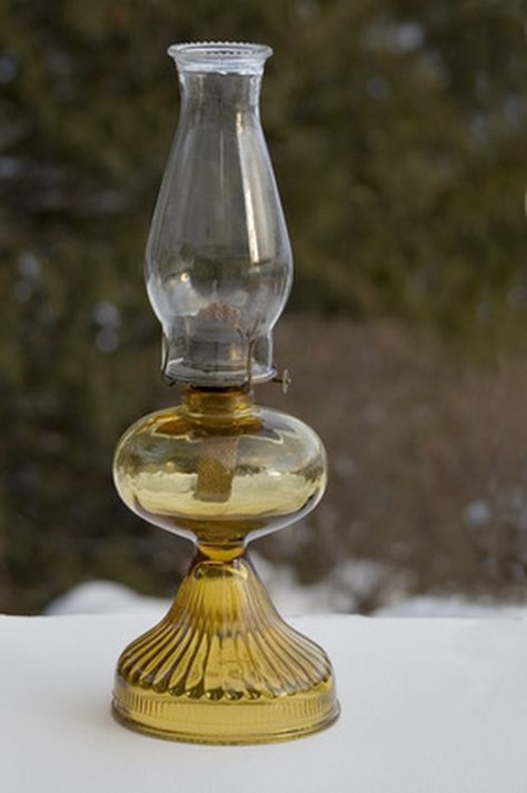 Oil lamp fuel is made from isopropyl alcohol and distilled water. Essential oil may be added to give the lamp oil a pleasant aroma. The isopropyl alcohol is available in most stores that carry rubbing alcohol. The isopropyl alcohol has an alcohol content of 91 or 99 percent. Oil Lamp Fuel, Lamp Oil, Homemade Oil, How To Make Oil, Tiki Torches, Prepper Survival, Isopropyl Alcohol, Kerosene Lamp, Emergency Prepping