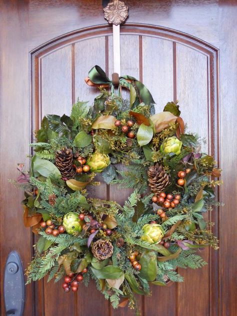 Add pine cones and assorted faux berries and greenery to an inexpensive grapevine wreath to create a gorgeous autumnal decoration you can display either indoors or out. Best of all: just add a red ribbon to transition this wreath from fall to Christmas. Wreath Hanging, Diy Fall Wreath, Magnolia Leaves, Thanksgiving Wreaths, Halloween Door, Christmas Door Decorations, Deco Floral, Door Decoration, Thanksgiving Decor